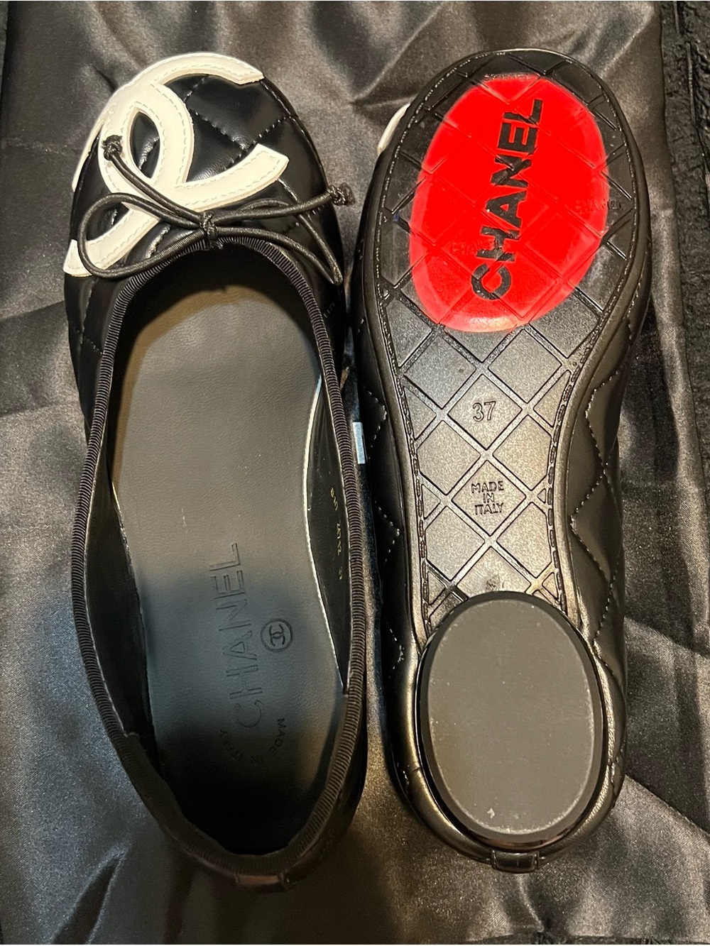 CHANEL Black and White Quilted Logo Ballet Flats with Red Sole Accent